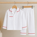 White Pyjamas with Red Piping